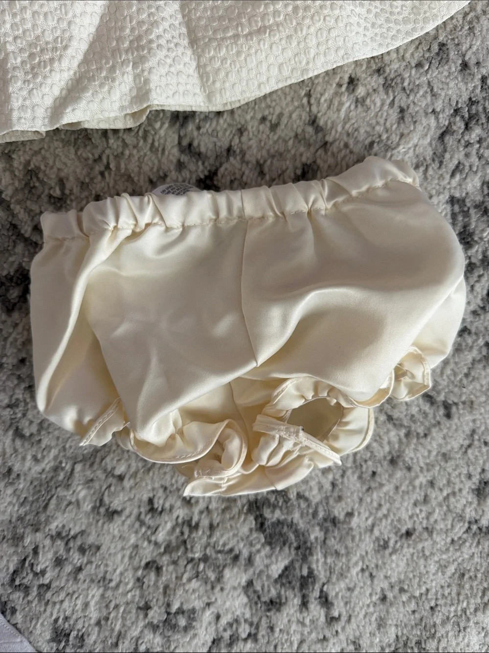 Pippa & Julie Ivory Textured Dress with Ruffle Front and Matching Bloomers
